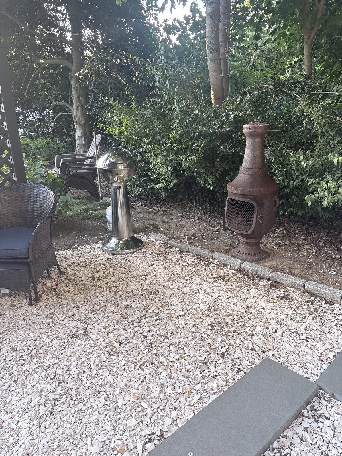 Crushed-shell patio with chiminea and seating